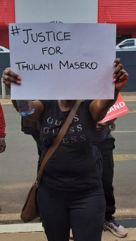 A protestor holds up a poster during a picket outside the offices of Consulate of Eswatini in Johannesburg on Friday.