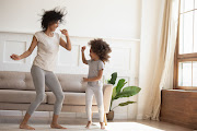 Having a dance party in your living room is a fun way to get you and your kids moving.