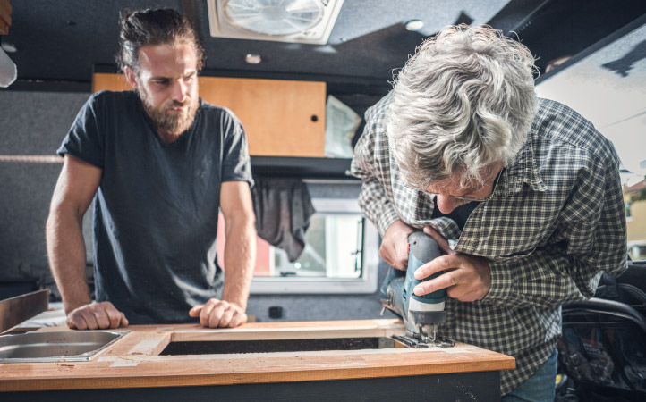 A father and son remodeling their RV cabinets and countertops