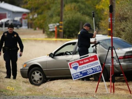 Police examine a vehicle that was involved in the string of shootings in Rancho Tehama. AGENCIES