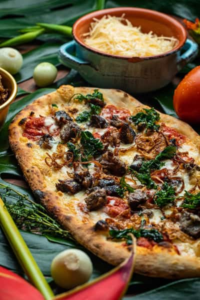 oxtail flatbread with tomato confit, fried onions, blended Italian cheeses