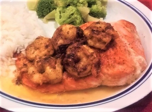 Salmon New Orleans - salmon seared in a honey-butter sauce that's topped with Cajun-seasoned Shrimp 