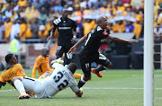 Luvuyo Memela scores past Itumeleng Khune of Kaizer Chiefs during the Absa Premiership match between Orlando Pirates and Kaizer Chiefs at Soccer City, Soweto on 03 March 2018.