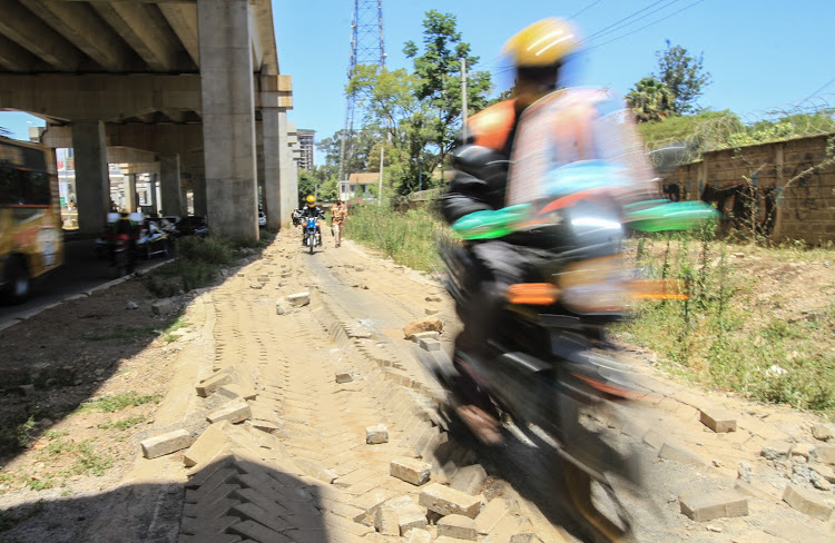 There is heavy investment in road infrastructure for vehicles, but pedestrian walk paths are unavailable or poorly maintained, and are also used by motorbikes.