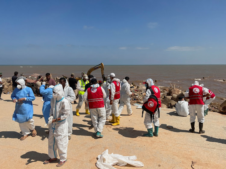 Rescue teams and members of Libyan Red Crescent search for dead bodies at a beach, in the aftermath of the floods in Derna, Libya, on September 16 2023. Picture: AYMAN AL-SAHILIREUTERS