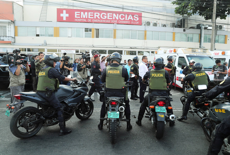 Police arrive outside a hospital where Peru's former President Alan Garcia was taken after he shot himself, in Lima, Peru