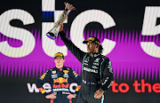 Race winner Lewis Hamilton celebrates on the podium during the F1 Grand Prix of Saudi Arabia at Jeddah Corniche Circuit on December 05, 2021 in Jeddah, Saudi Arabia.