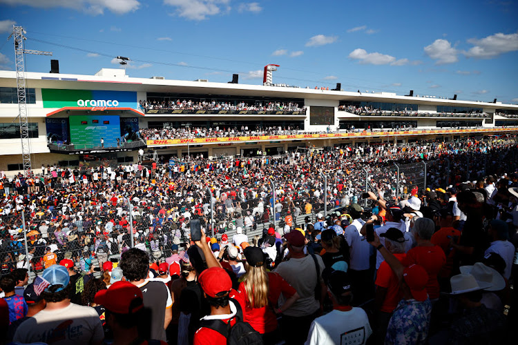 A general view of the podium celebrations with race winner Max Verstappen of Netherlands and Red Bull Racing, second placed Lewis Hamilton of Great Britain and Mercedes GP and third placed Sergio Perez of Mexico and Red Bull Racing during the F1 Grand Prix of USA at Circuit of The Americas on October 24, 2021 in Austin, Texas.