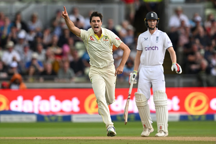 Pat Cummins of Australia celebrates taking the wicket of Ben Duckett of England, caught by Cameron Green on day three of the first Ashes Test at Edgbaston on June 18 2023.