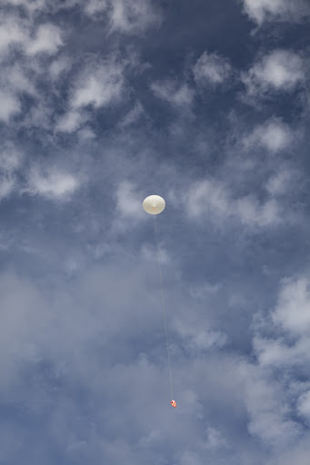 Rocket University participants release a balloon to carry an instrument package as part of an aerial experiment by the program.