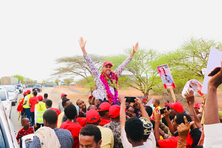 Wajir governor aspirant Ugas Sheikh-Mohamed acknowledges greeting from his supporters in Wajir town on Monday, February 21.