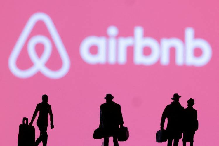 Figurines are seen in front of the Airbnb logo in this illustration. Picture: DADO RUVIC/REUTERS