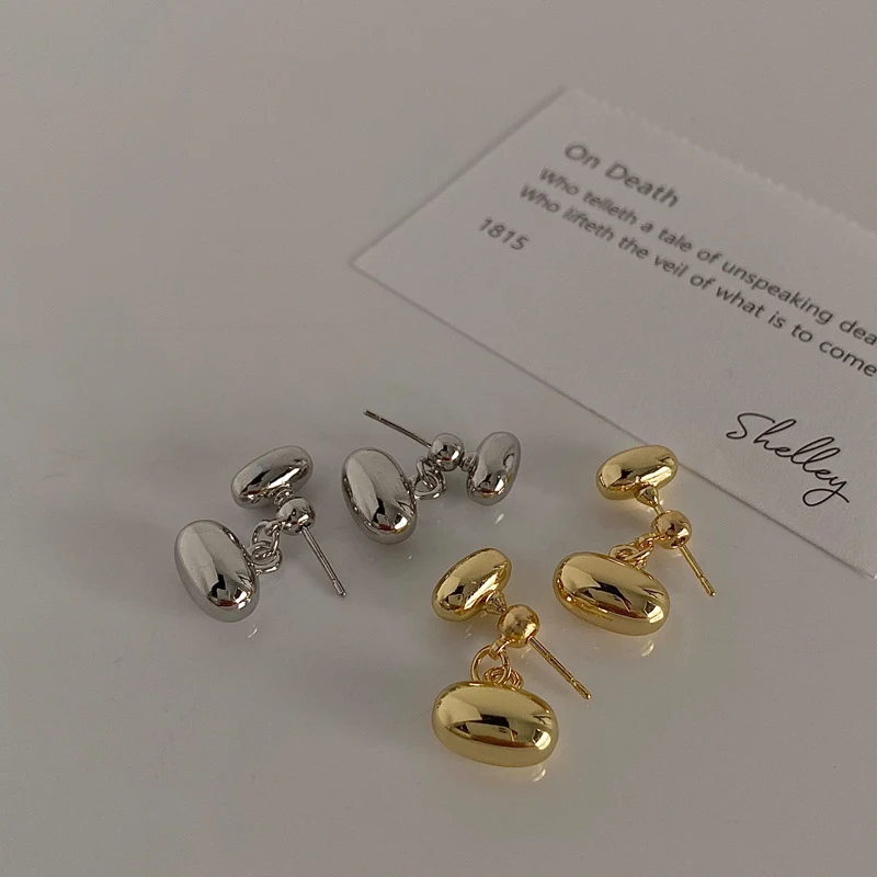 Brincos femininos estilo Ins, duplos em formato de feijão nas costas, banhados a ouro real sobre cobre, design moderno.