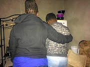 A 13-year-old rape victim is    comforted by her mother at their  KaNyamazane home in  Mbombela, Mpumalanga. 