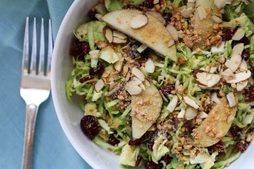 Shaved Brussels Sprouts Salad with Pear, Cranberries, and Vegan Parmesan