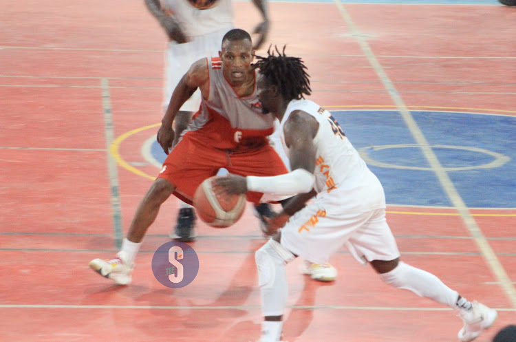 Nairobi City Thunder's Griffin Ligare dribbles past Equity Dumas Victor Bosire during the finals of the Eliud Owalo tournament at Ulinzi Sports Complex on May 12, 2024.