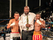 Promoter Ayanda Matiti is flanked by young boxing prospects Sabelo Nkosi, left,  and Ntlantla Tyira at Orient Theatre recently. 