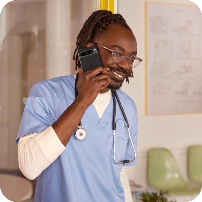 A doctor taking a call on his Pixel phone.