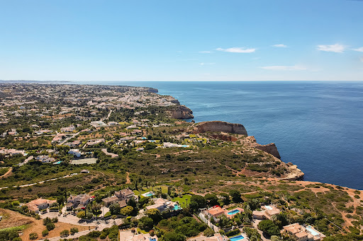 Aerial view of coastal villas and sea in this luxury house for sale in Lagoa ($1,142,518)