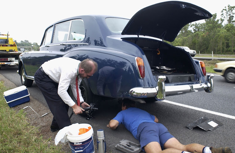 Many people lack the confidence and knowledge to perform simple car maintenance tasks, which can leave them stranded in the event of a flat tyre or dead battery. Picture: GETTY IMAGES