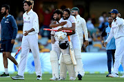 Rishabh Pant and Mohammed Siraj of India celebrate victory after day five of the 4th Test Match in the series between Australia and India at The Gabba on January 19, 2021 in Brisbane, Australia.