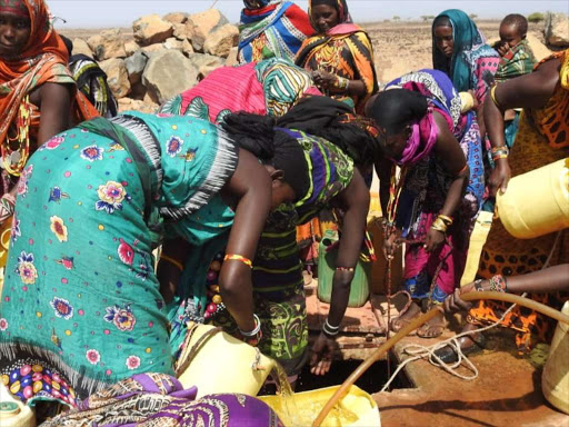 Women fetch water for domestic use from an underground tank at Qatamur, North Horr sub county. This follows the drying out of other water sources including water pans. IRENE MURITHI