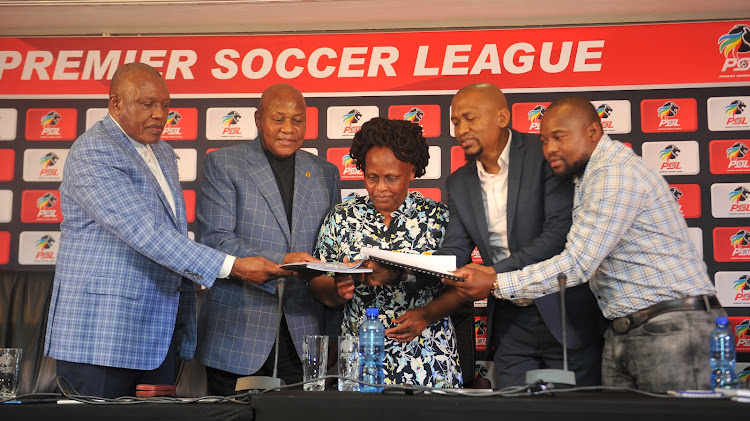 PSL chairman Irvin Khoza, Kaizer Chiefs chairman Kaizer Motaung, PSL acting chief executive Mato Madlala, SA Football Players' Union president Thulaganyo Gaoshubelwe and general secretary Nhlanhla Shabalala during a press conference at the PSL offices in Parktown on November 26 2019.