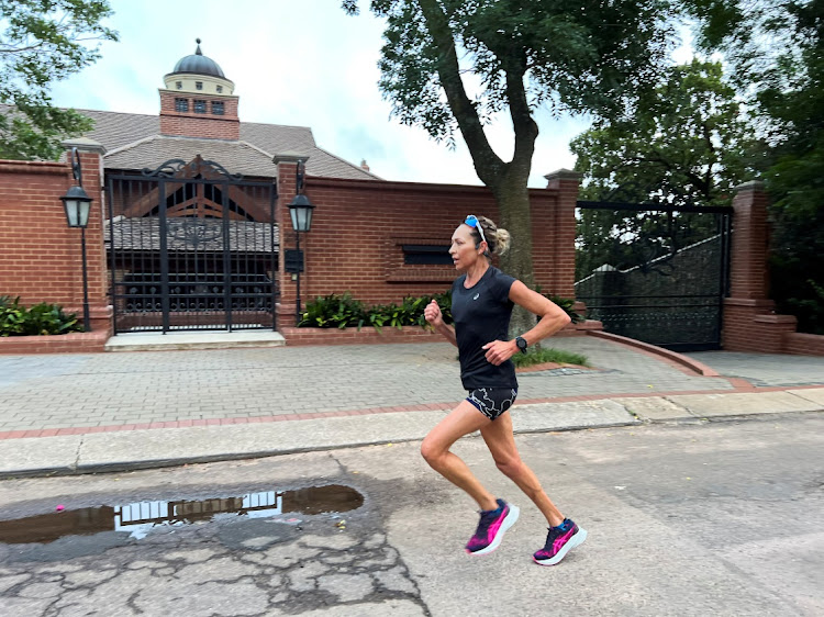 A woman jogs past the house of Oscar Pistorius' uncle Arnold, ahead of Oscar Pistorius' release from prison, in Pretoria, on January 5, 2024