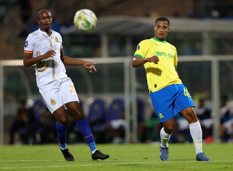 Mamelodi Sundowns midfielder Rivaldo Coetzee challenges for the ball with Levy Mashiane of Royal AM during their DStv Premiership match at Lucas Moripe Stadium.