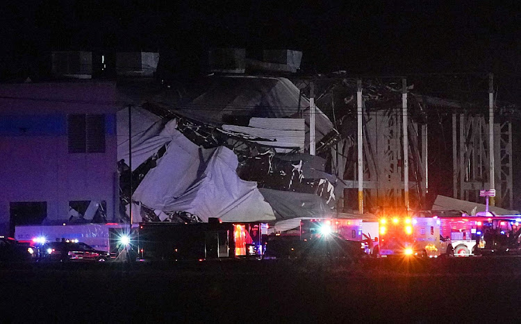 Emergency vehicles surround the site of an Amazon distribution warehouse with a collapsed roof, after storms hit the area of Edwardsville, Illinois, U.S. on December 10, 2021.