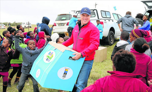 MBSA CEO Arno van der Merwe offloads some of the books and educational toys that were distributed to 10 rural schools in Butterworth and Nqamakwe on Saturday.