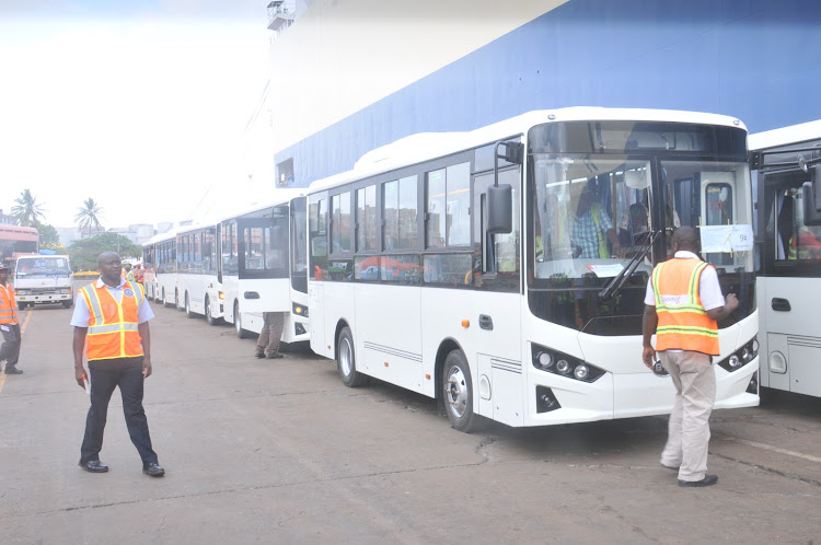 A fleet of 15 electric buses that have been imported awaiting dispatch from the Port of Mombasa on Tuesday, November 29, 2022.