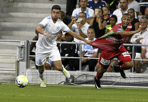 Andile Jali of KV Oostende pulls away from Morgan Sanson of Olympique Marseille in a Europa League qualifying match. Jali's contract with Oostende ends in June.