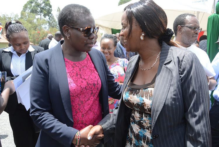 Lands CS Farida Karoney (L) has a word with Nakuru County Chief officer for Lands and Physical Planning Judy Leah Waihenya during the launch of Naivasha Constituency Lands Clinic in the lake side town.