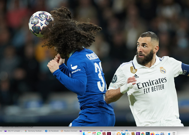 Real Madrid's Karim Benzema (R) vies for the with Chelsea's Marc Cucurella