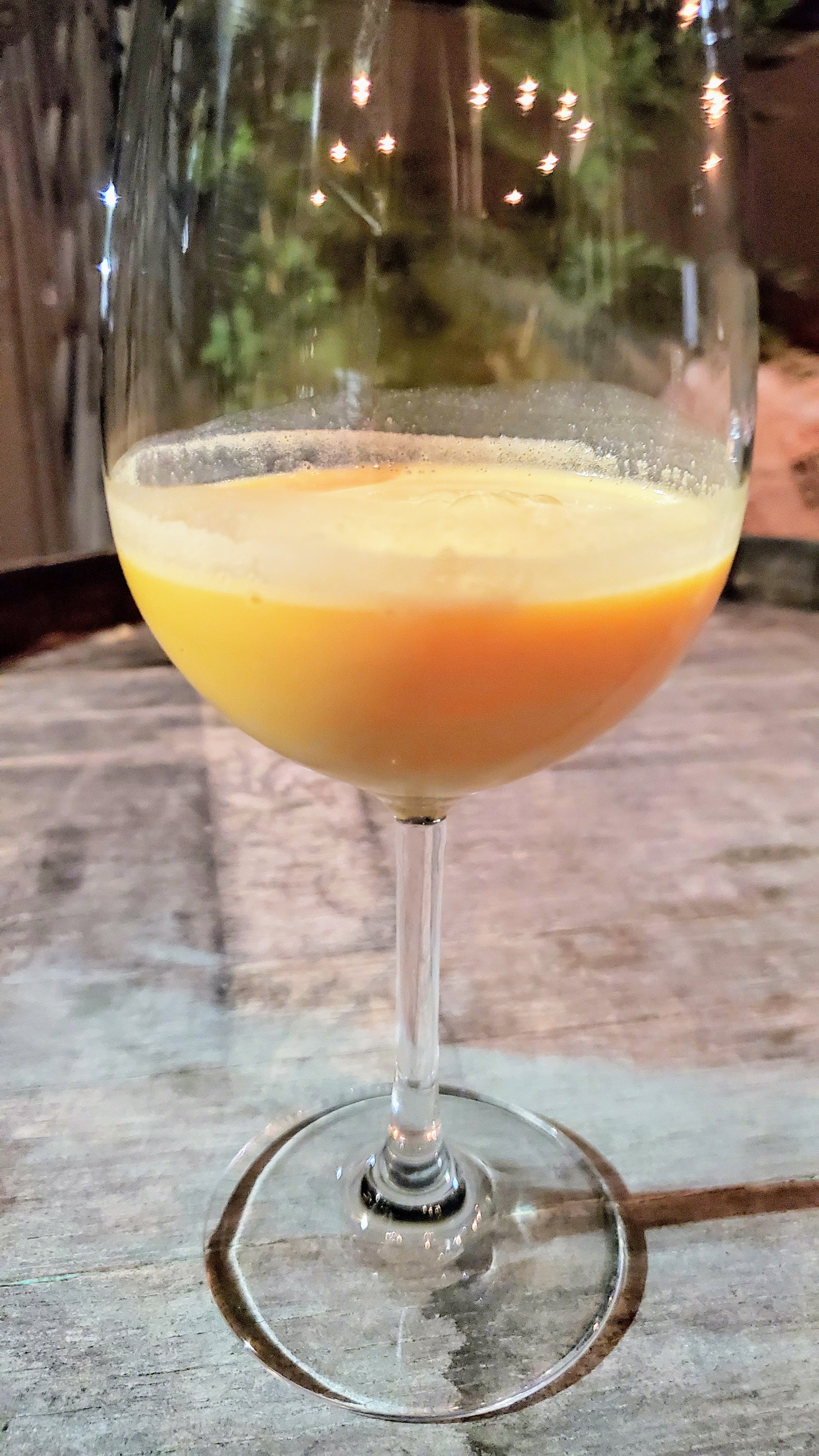 Eric Nelson of Eem created this zero proof mocktail non-alcoholic clear headed beverage with Turmeric, Pineapple, Vinegar, OJ, Coconut, Zheng Shan Smoked Black Tea, Star Anise at the More Zero Proof Dinner at Feast 2019