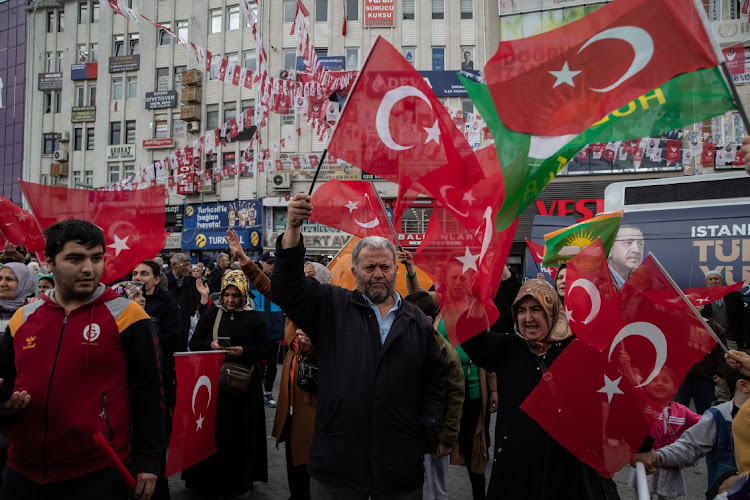 Supporters of Turkey’s President Recep Tayyip Erdogan wave flags during a campaign event in Istanbul, Turkey, May 9 2023. Picture: BURAK KARA/GETTY IMAGES