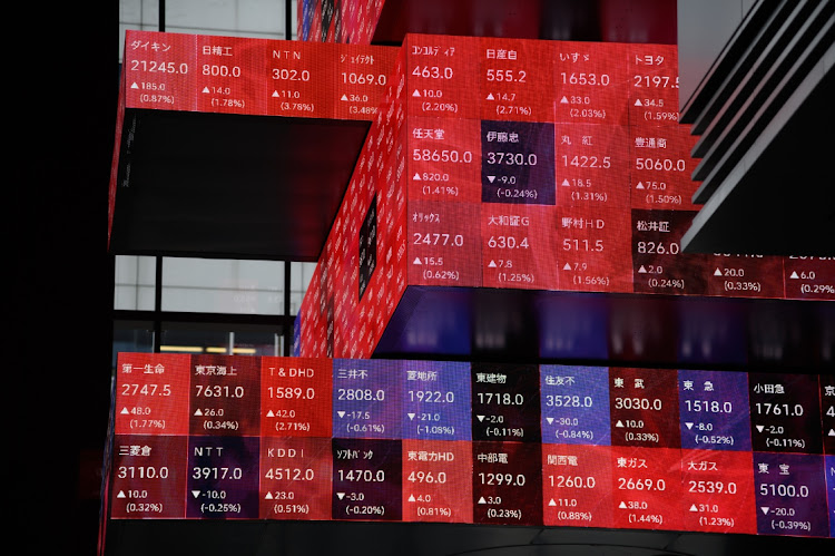 Stock figures on a rotating-cube screen in an atrium of the Kabuto One building, next the Tokyo Stock Exchange, in Tokyo, Japan, on June 7 2022. Picture: BLOOMBERG/AKIO KON