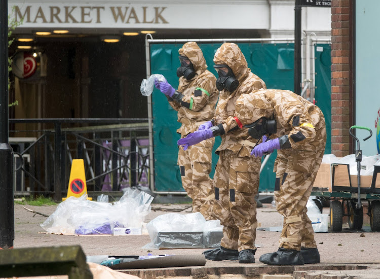 Members of the military work in the Maltings shopping area, close to the bench where Russian former double agent Sergei Skripal and his daughter Yulia were found critically ill seven weeks ago.