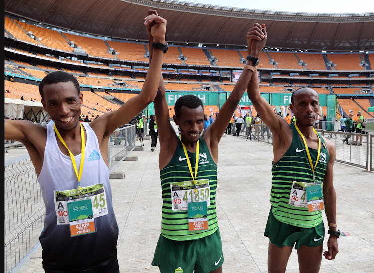 The 2022 Soweto Marathon winner Daba Ifa Debele of Ethiopia is flanked by countryman Gadisa Gutuma who finished second and third placed Tsepo Ramashamole of Lesotho. The first South African man home was Ntsindiso Mphakathi, who finished fifth.