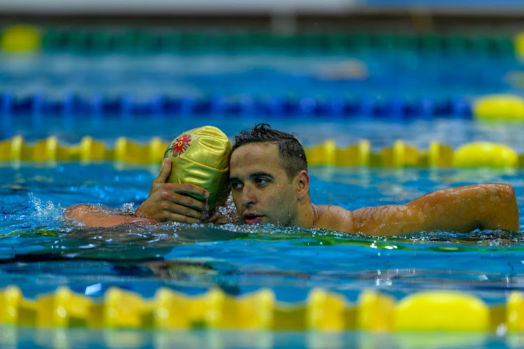 Dethroned Chad le Clos congratulates Pieter Coetzé after the teen won the men's 100m freestyle title at the South African championships in Gqeberha on Tuesday night.