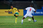 Bafana Bafana's Themba Sikhakhane threads a pass past Eswatini's Bongwa Matsebula in their 2023 Cosafa Cup match at Princess Magogo Stadium in Durban on July 11 2023.