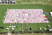 The 4,500 blankets unveiled at Steyn City will be given to Gift of the Givers to distribute to those affected by floods in KwaZulu-Natal.