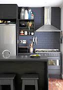 Black painted bricks add texture to the kitchen in this suburban family home.