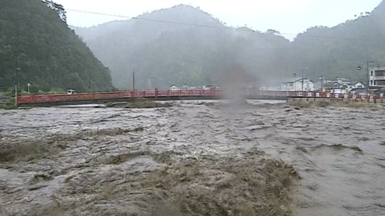 The swollen Sendai River caused by Typhoon Lan is seen in Tottori, western Japan, August 15, 2023, in this video grab image taken from a live video camera released by Ministry of Land, Infrastructure, Transport and Tourism and received via Kyodo.