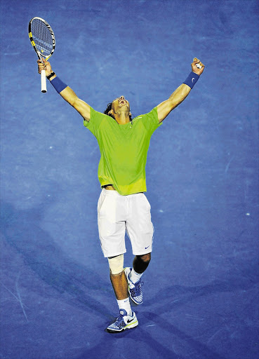 Spain's Rafael Nadal raises his arms in triumph after pounding stubborn Czech, Tomas Berdych, to defeat in their quarterfinal at the Australian Open in Melbourne yesterday Picture: REUTERS