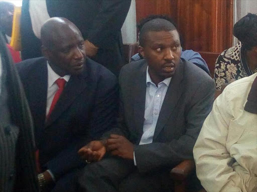 Former NHIF finance manager Simon Kirgoty and ex-CEO Geoffrey Mwangi at a Milimani court on Monday, December 10, 2018. /COLLINS KWEYU