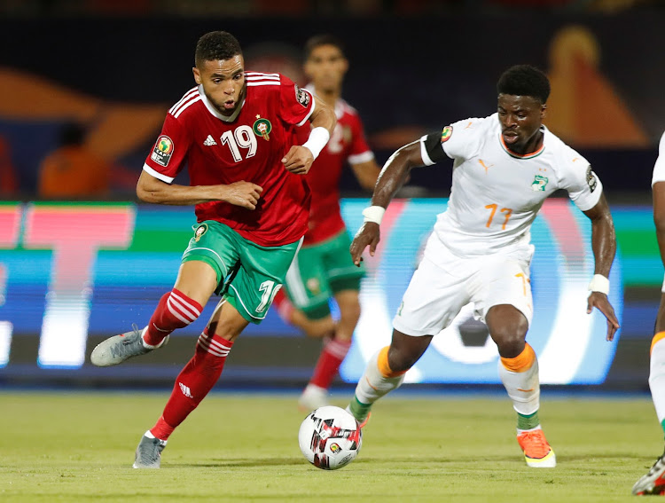 Morocco's Youssef En-Nesyri in action with Ivory Coast's Serge Aurier