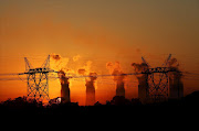 Electricity pylons at an Eskom coal-burning power station near Sasolburg. Picture: REUTERS/ SIPHIWE SIBEKO