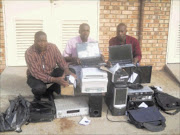 HARD WORK: Tonga police spokesperson Sergeant Mzwandile Nyambi, detective constables Dumisani Zwane and Lucky Mhlanga display stolen goods recovered in Mgobodzi in Mpumalanga yesterday. Pic: MASOKA DUBE. 18/05/2010. ©Sowetan.